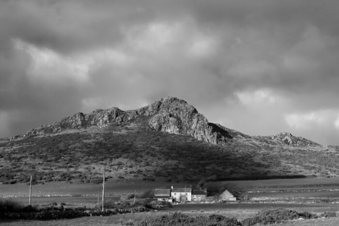 A youth hostel located below a rocky outcrop