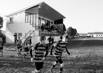 A rugby team runs out for a match