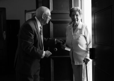 An elderly lady arrives at chapel