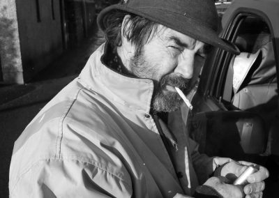 A man lights a cigarette
