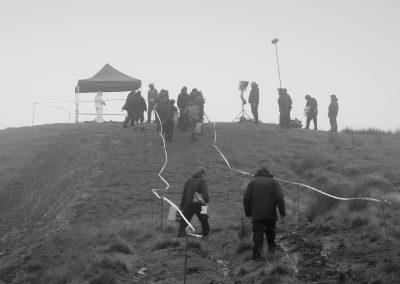 Film crew setting up on a hill in the Cambrian Mountains
